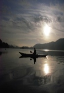 Winter sunset kayaking in Windermere in The Lake Disrtict.
